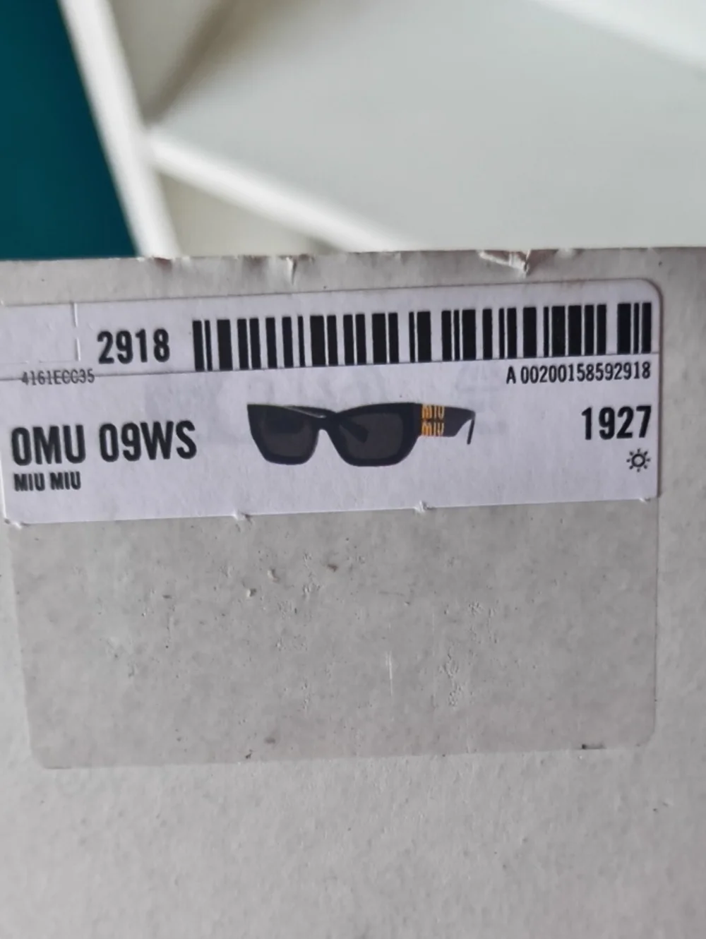 Miu Miu Black Sunglasses with Gold Logo Accent